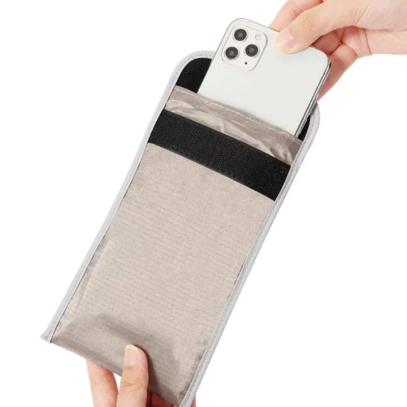 Sliding a phone into the Faraday pouch