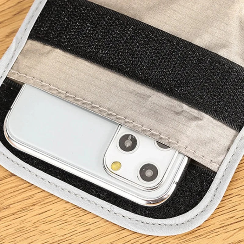 Faraday pouch hook-and-loop closure with phone inside