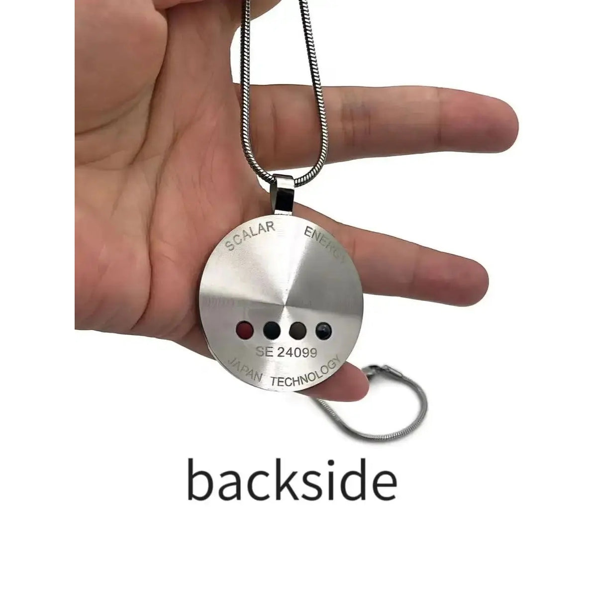 Back side of the silver pendant in hand