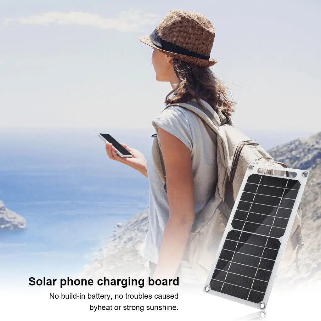 Portable solar phone charger on a backpack by the sea