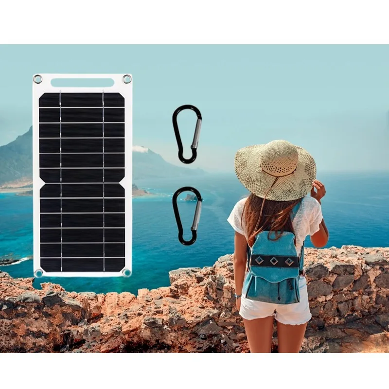Solar charger clipped to a backpack outdoors