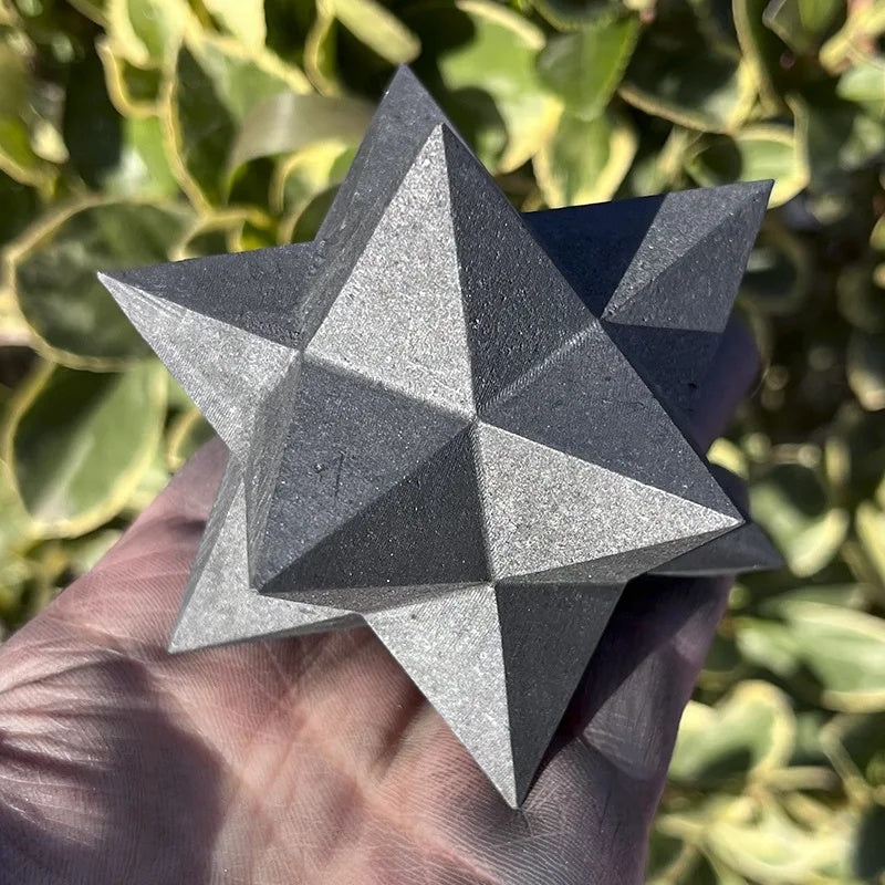 Shungite star in the palm