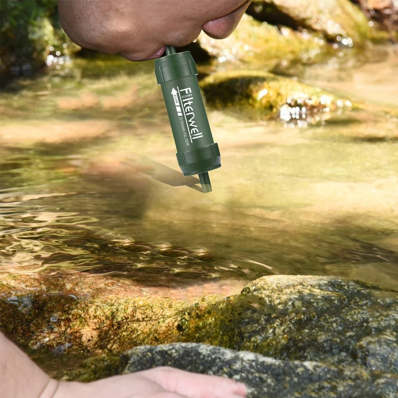 Drinking straight from a stream with the water filter straw